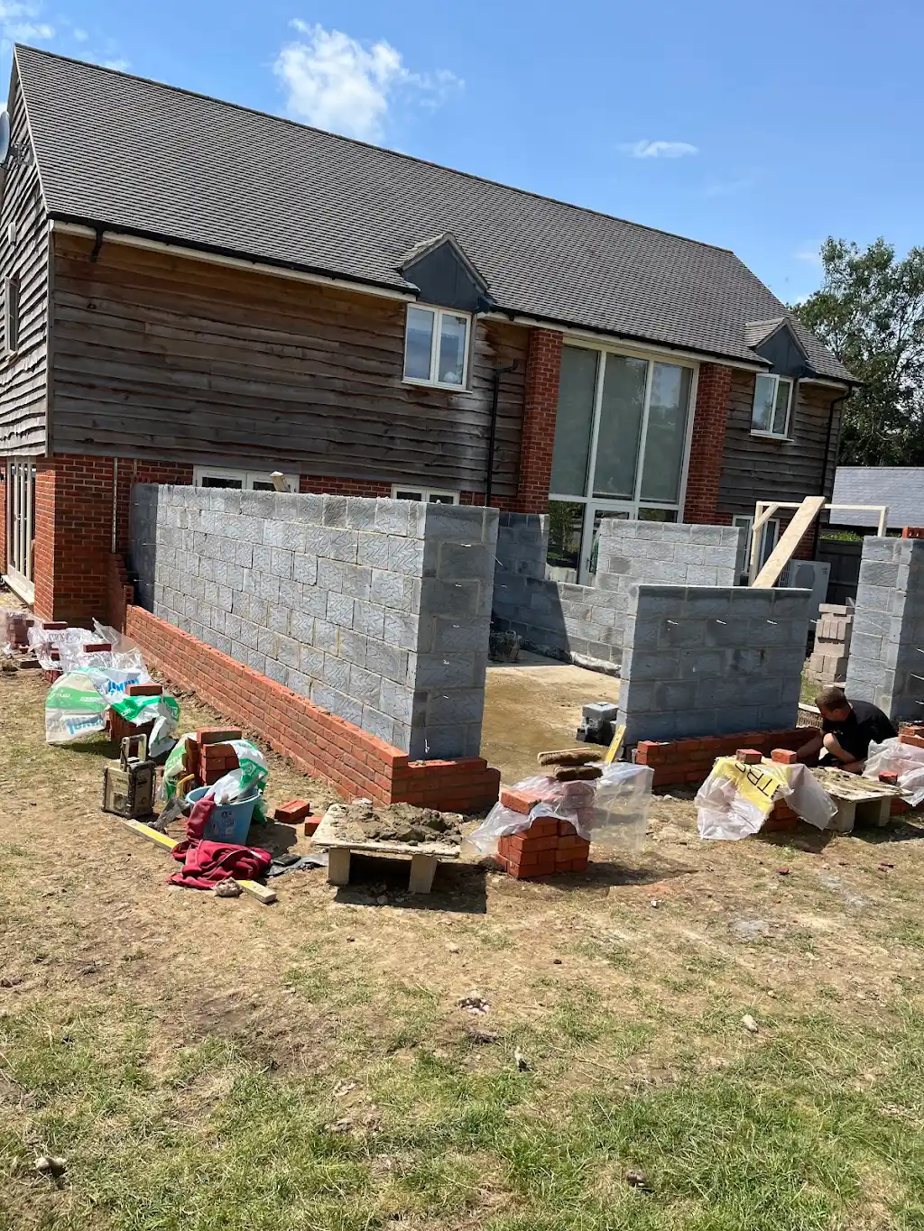 Blockwork walls progressing across the wider rear elevation