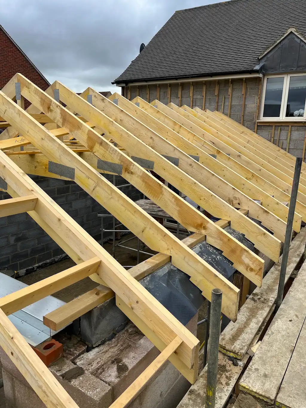 Hand-cut rafters on the smaller gable section
