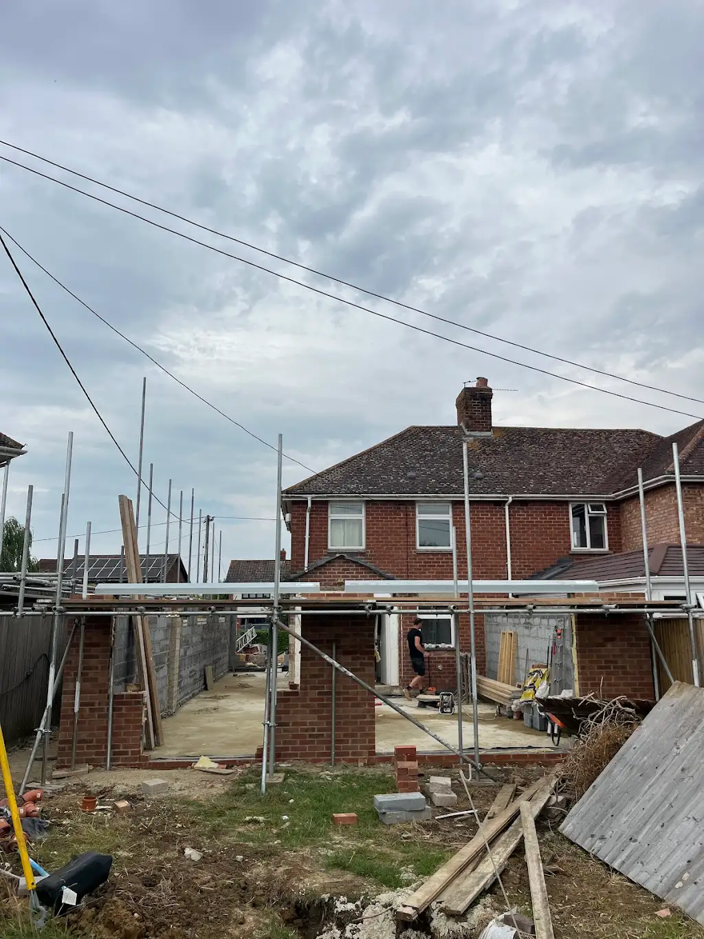 Brick skin going up with scaffolding in place