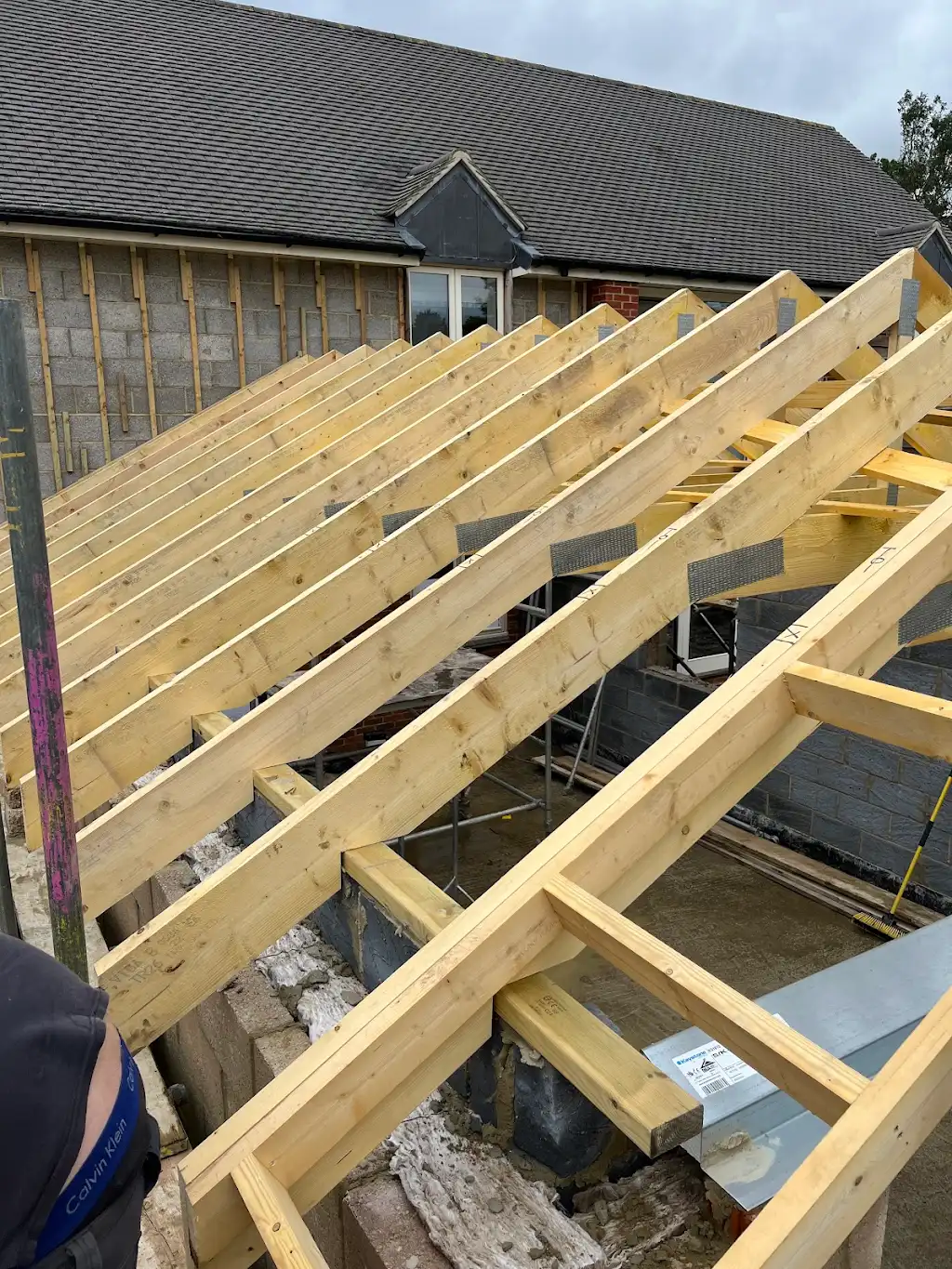 Rafters and ridge tying into the existing main roof