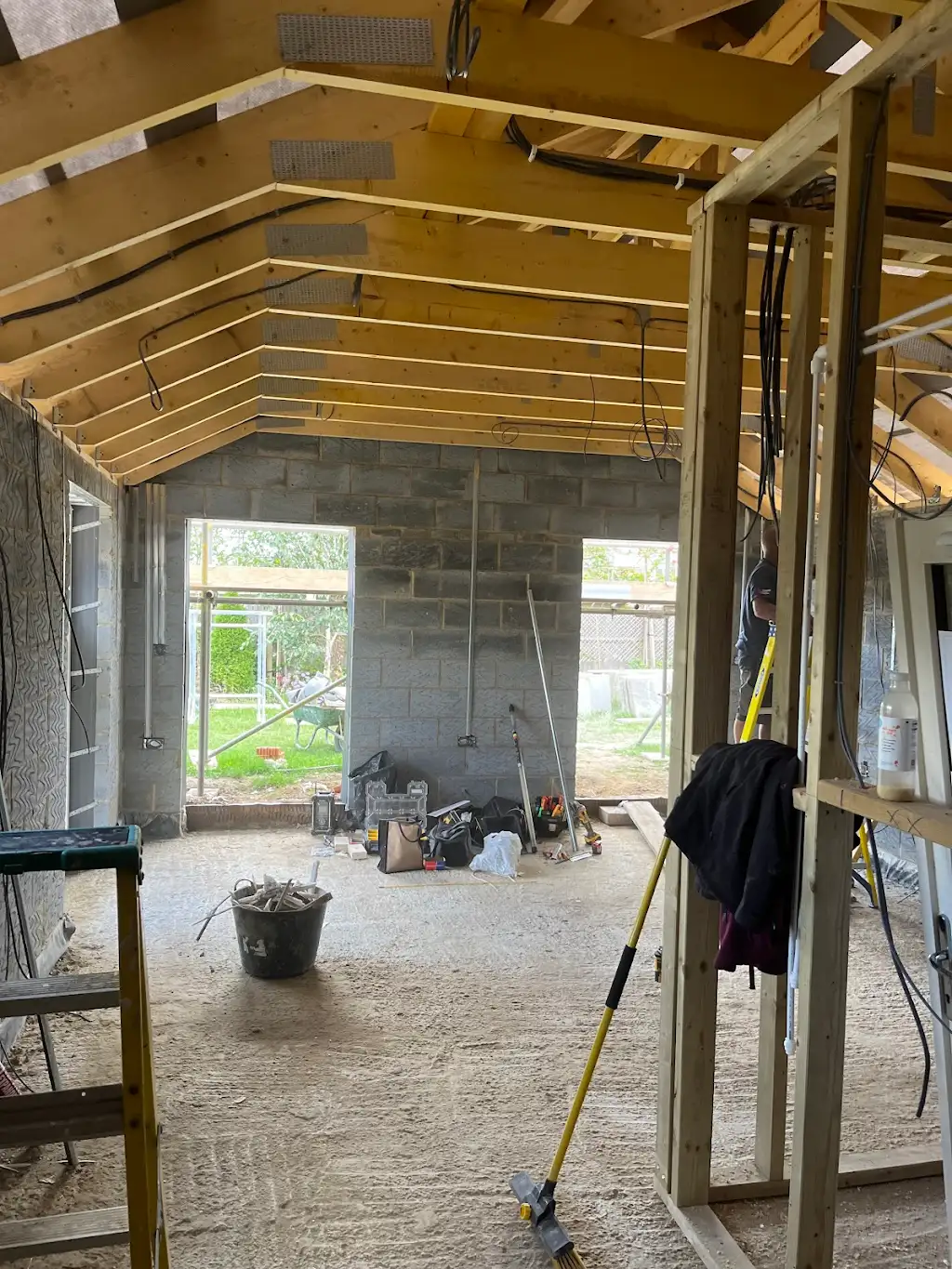Inside the new extension showing exposed roof timbers and stud walls