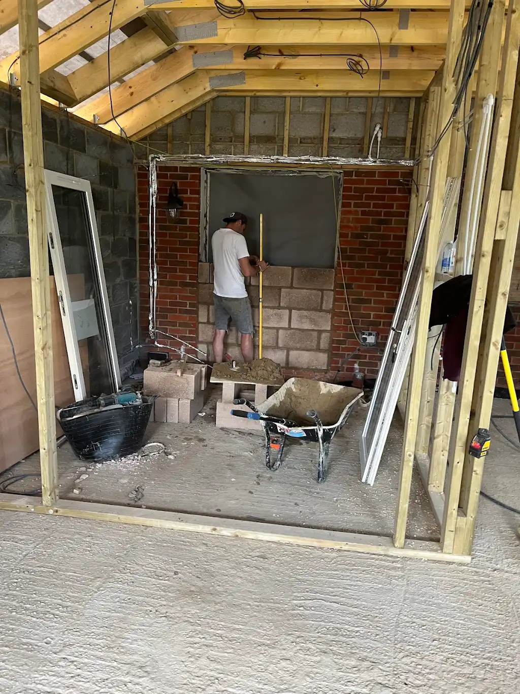 New blockwork doorway being formed through to the existing kitchen